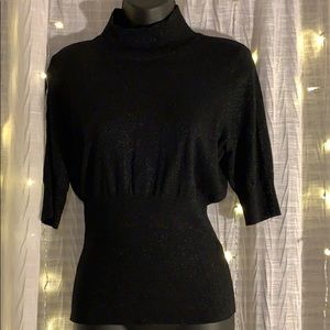 Black three-quarter sleeve turtleneck shirt